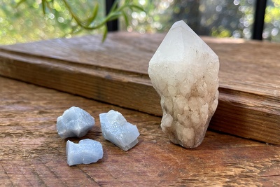 Example 2 of Enchanted Crystal Crystal of the Month, crystal subscription box, a a candle quartz and blue calcite bonus mini crystals