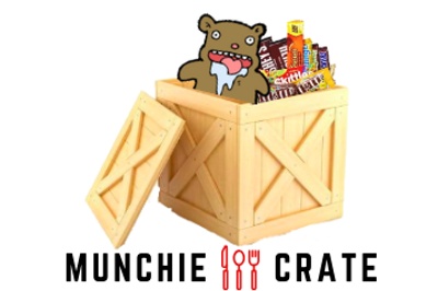 A wooden crate filled with a bunch of candy bars and a animated teddy bear that's drooling. Munchie Crate is at the bottom.