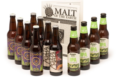 Several beer bottles of different types of IPA and a booklet called Malt of the Earth from The Hop-Heads Beer Club.
