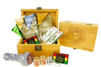 A Hakuna Supply subscription box filled with eco-friendly stone bundles including rolling papers, hemp wick rolls and more.