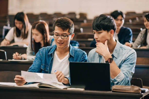 students in class looking at work 