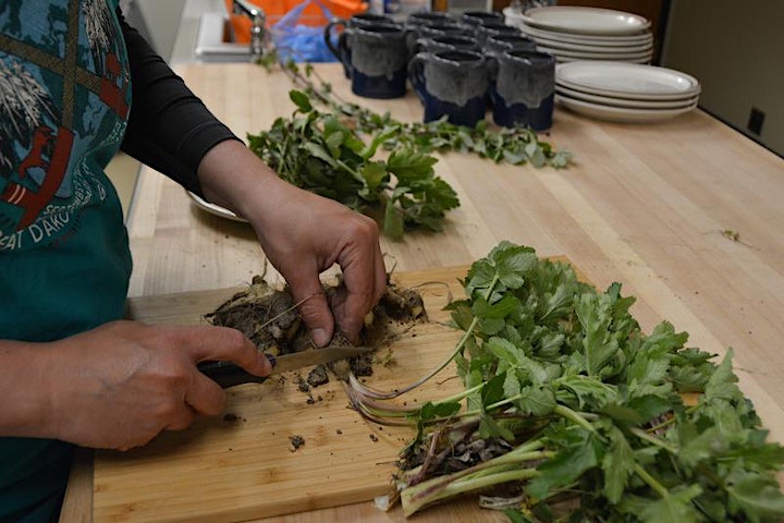 Wild Edibles participant chopping up harvested greens