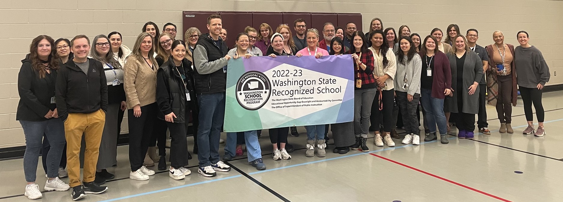 Fairmount Staff proudly shows our new award 