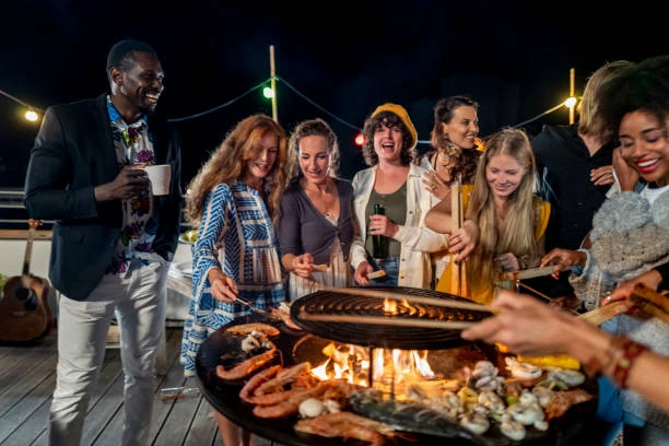 a group of friends having a cook off 