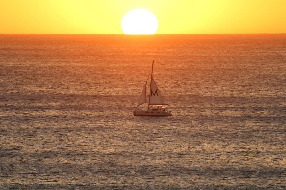The MANAKAHI, MANA Cruises' flagship sailing vessel out of Ko Olina on a sunset cruise on the Leeward Coastline.