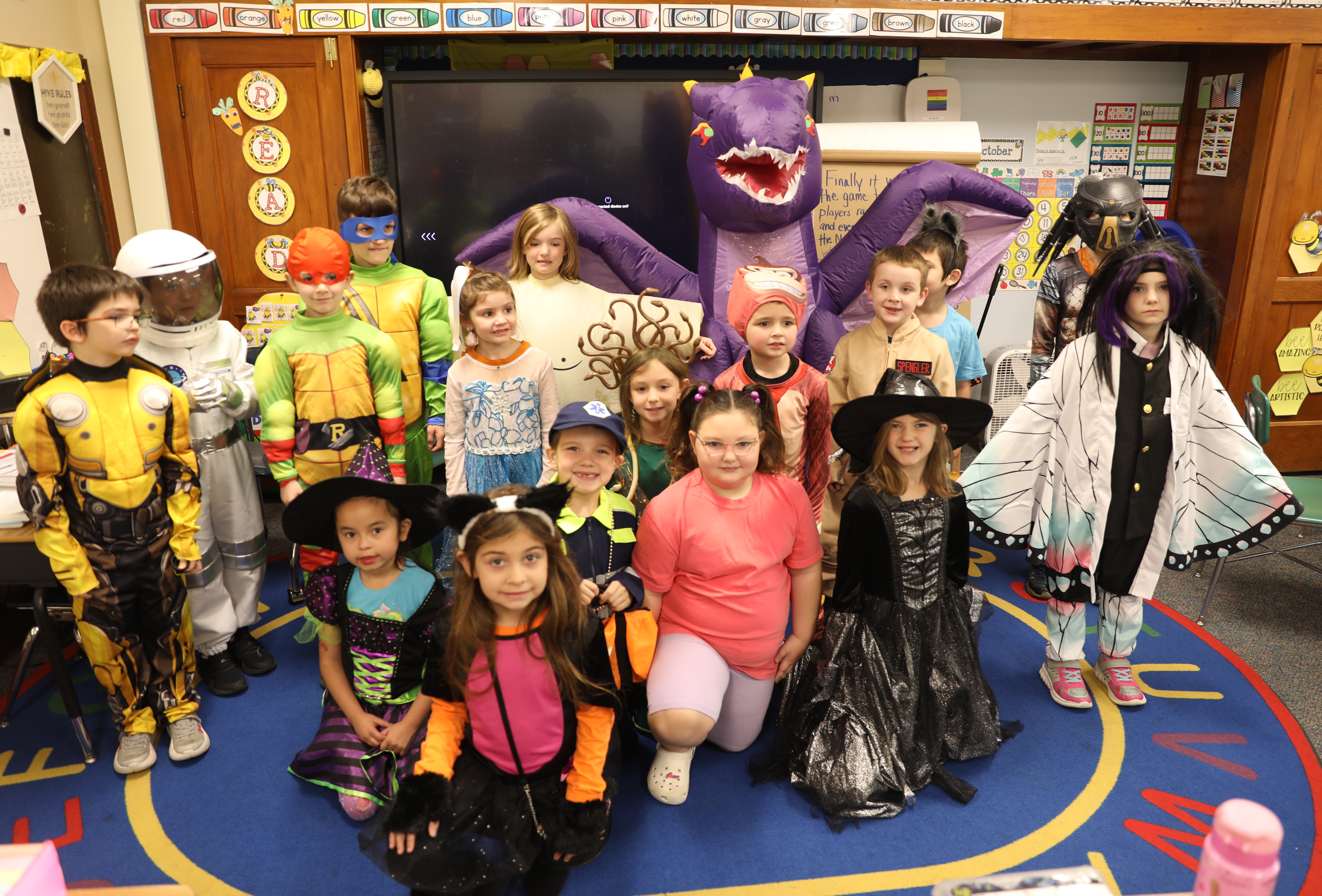 A class dressed in costumes poses for a group photo before the K-2 Costume Parade