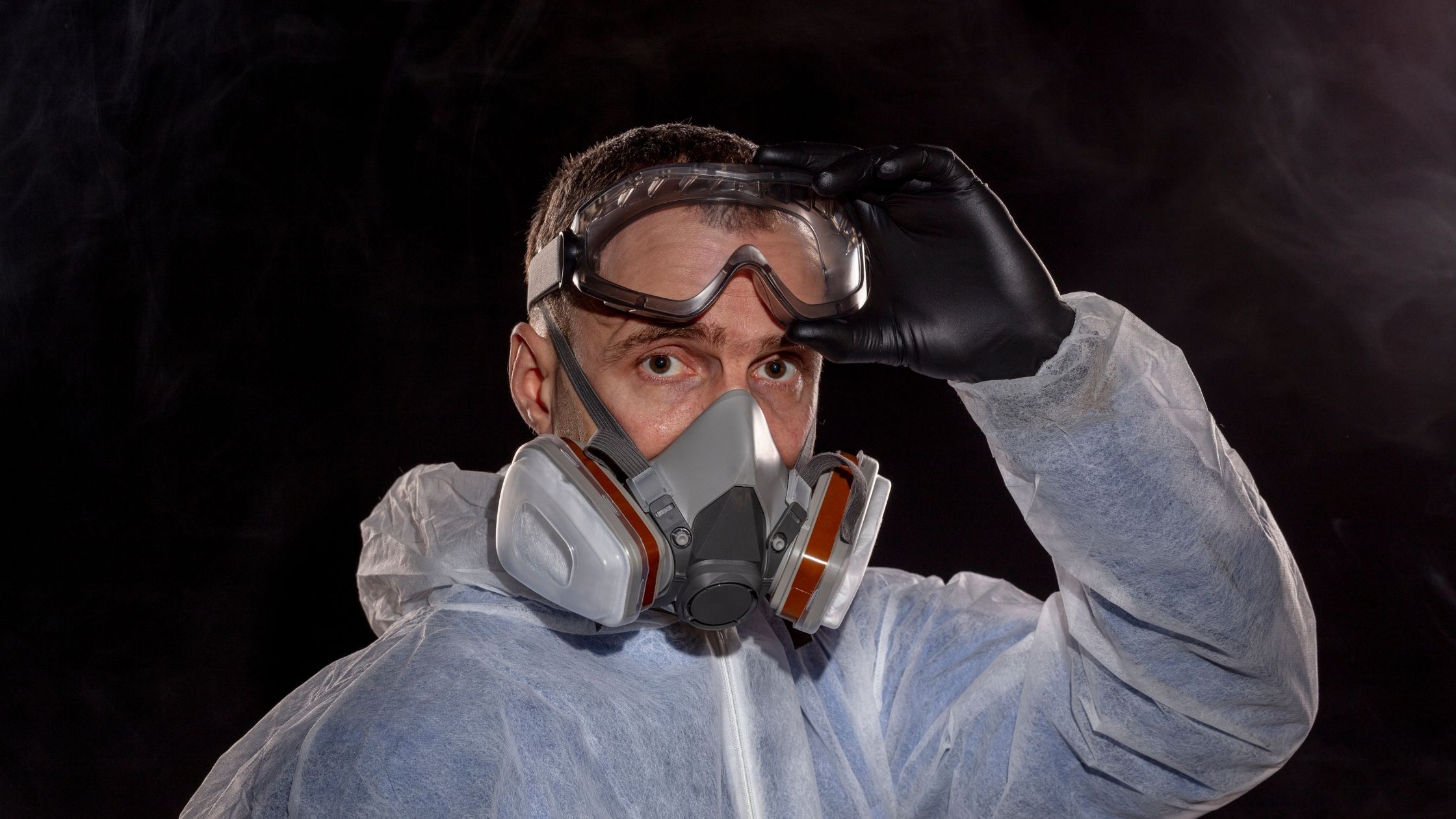 man wearing proper safety equipment to work with epoxy resin