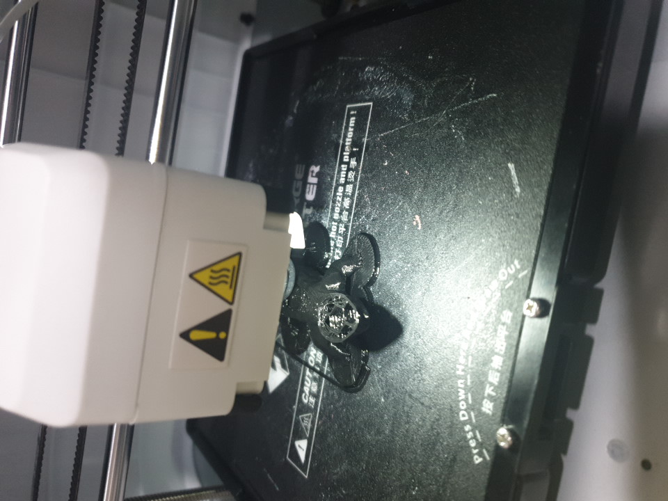 The image shows a 3D printer's nozzle area with a possible new sensor installed after repairing a filament detection issue.