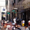 Men at an outdoor cafe on Umar al Mukhtar street.