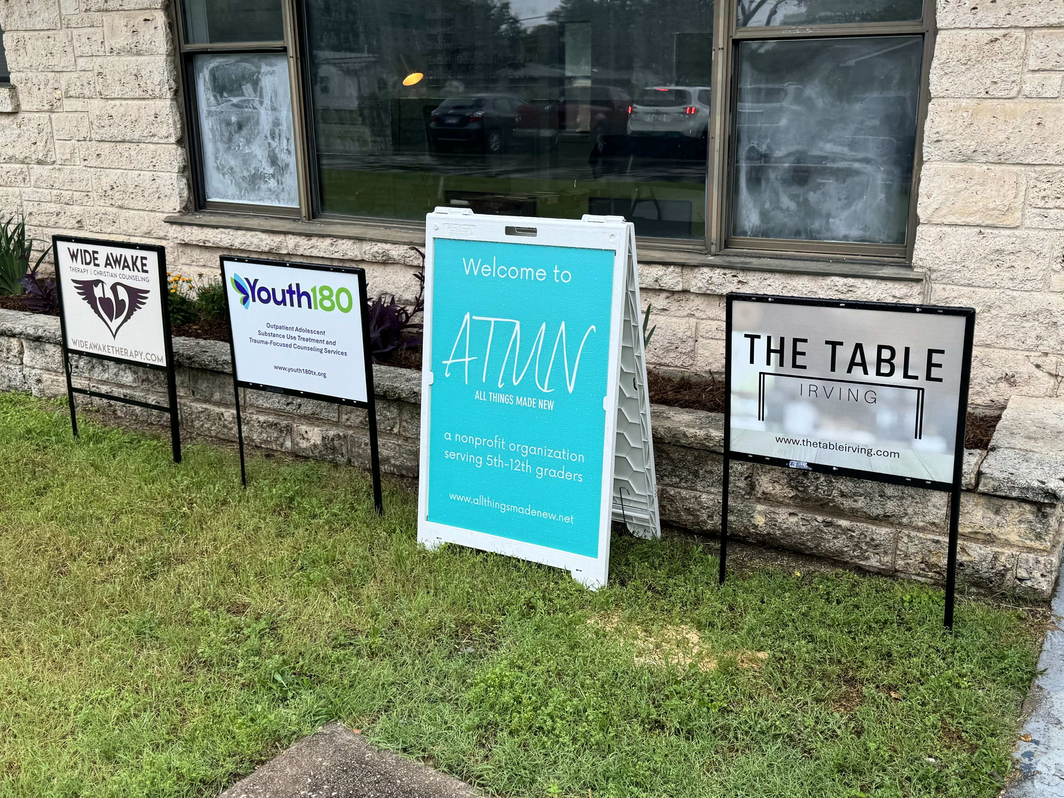 Table Irving Community Center Open house May 2024 signs.jpeg