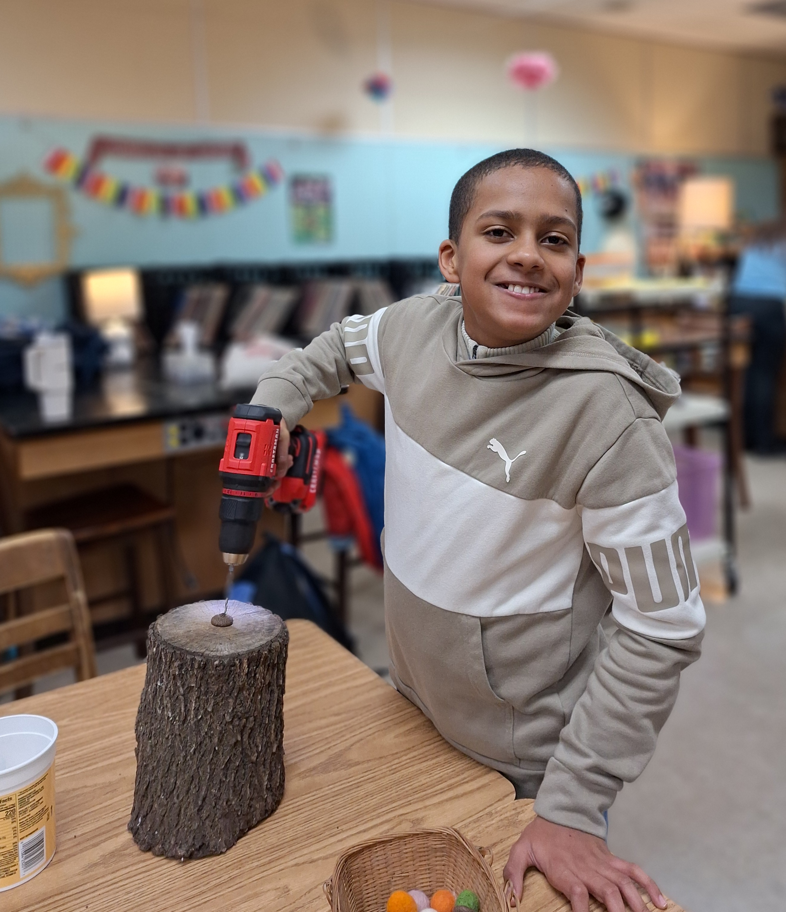 Fallou works on a project for the  Display, Design, and Crafts class (unified art).