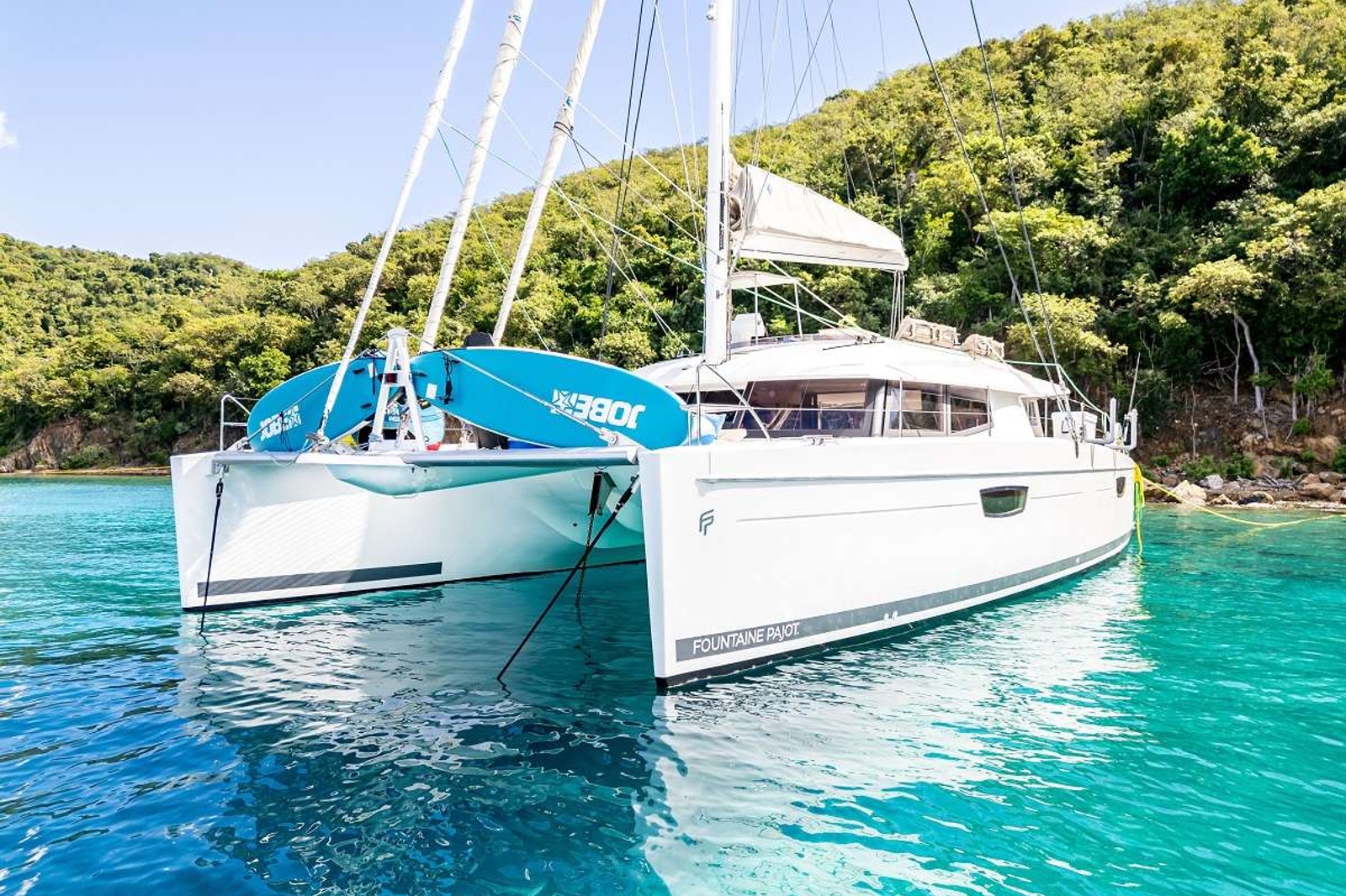 Unwind in luxury and style aboard this stunning 2018 Fountain Pajot sailing catamaran, meticulously crafted to accommodate up to 8 guests on a luxurious 58ft catamaran

Step into the primary cabin, where a plush king-size bed awaits, complemented by a spacious work desk and a cozy lounge area, perfect for unwinding after a day of adventure.

Three additional well-appointed cabins offer ample space and comfort, each boasting a queen-size berth, ensuring that every guest can retreat to their own private sanctuary.

Embark on unforgettable voyages, surrounded by breathtaking scenery and the tranquility of the open seas, aboard this exceptional catamaran.