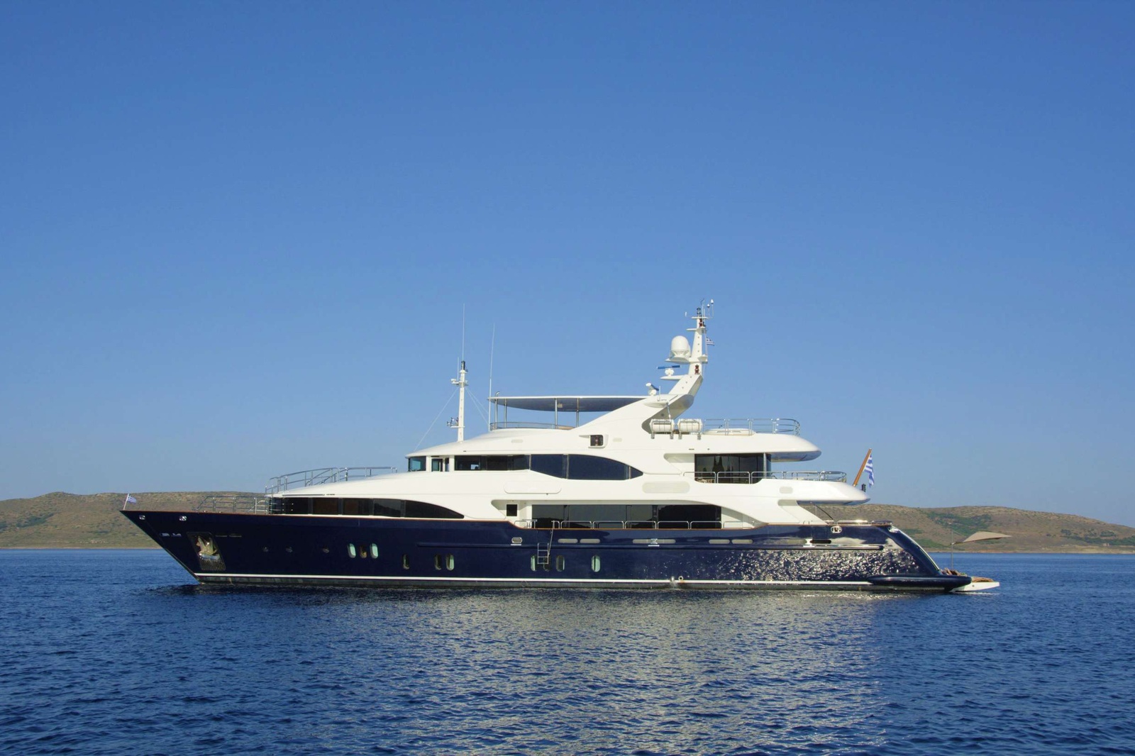 360 Virtual Tour: https://www.digitalimages.gr/panoramata/GrandeAmore/GrandeAmore.html

GRANDE AMORE is a stunning 44 meter, Benetti 145 Vision built in 2006 and last refitted in 2020, based in Greece.
Her Key Features are: 6 cabins (2 Masters with private terraces), BEACH CLUB, JACUZZI on deck, STABILIZERS (Zero Speed & Underway), ELEVATOR to 3 decks, WHEELCHAIR Accessibility, 2nd Escort TENDER boat (10m) & many other Special Features.
Full ABS classed boat with a beam of 9.3m and a draft of 2.7m, she has a GRP hull and superstructure and top cover and can accommodate 12-14* guests in 6 cabins.
Her STABILIZERS (Zero Speed & Underway) offer her great stability in rough seas.
GRANDE AMORE has been built to the highest standards of the industry by the world famous Benetti shipyard and boasts an elevator connecting the 3 decks.
The elevator is a unique option that is not found in many yachts. This makes getting around this Tri-Deck something of ease for any person having mobility problems or any type of handicap.
Refitted extensively in 2015, 2017, 2020, GRANDE AMORE has a modern style throughout with interior design by Francois Zuretti and exterior by Stefano Righini.

Her contemporary decor accentuates the spacious feel through the yacht, as does the full-height sliding doors on both the main and upper deck.

The sophisticated cabin layout features a MASTER suite with fantastic 180 degree views, a private deck forward of the owners suite and an office room, which can be separated by the cabin to be used also as a common area.
The wonderful 2nd MASTER suite faces aft with a view throughout the stunning second deck circular SKYLOUNGE onto the deck offering an abundance of natural light. The SKYLOUNGE can be either joined to the cabin or totally separated by a door, to be used also as a common area.

The HUGE SUN DECK is a prime location for entertaining, partially shaded by a fixed Hard Top, it features a fully equipped bar, large pool JACUZZI, table for al fresco dining and areas to sunbath.
The massive garage accomodates a Castoldi jet tender J15, jet skis, dive/snorkel equipment & other toys very nicely.
When at anchor the garage transforms to a stunning BEACH CLUB with a sauna, gym equipment and an Ultra- Large 
SWIMMING PLATFORM (opening - 14 sq. meters).

BEACH CLUB DIMENSIONS (total): 36 sq. meters.
BEACH CLUB interior = 22 sq.meters (5m x 4.4m) + SWIMMING PLATFORM = 14 sq.meters (3.2m x 4.4m))

She is powered by 2 Caterpillar engines of 1300 hp each, giving her a maximum speed of 16 knots and a cruising speed of 14 knots.
