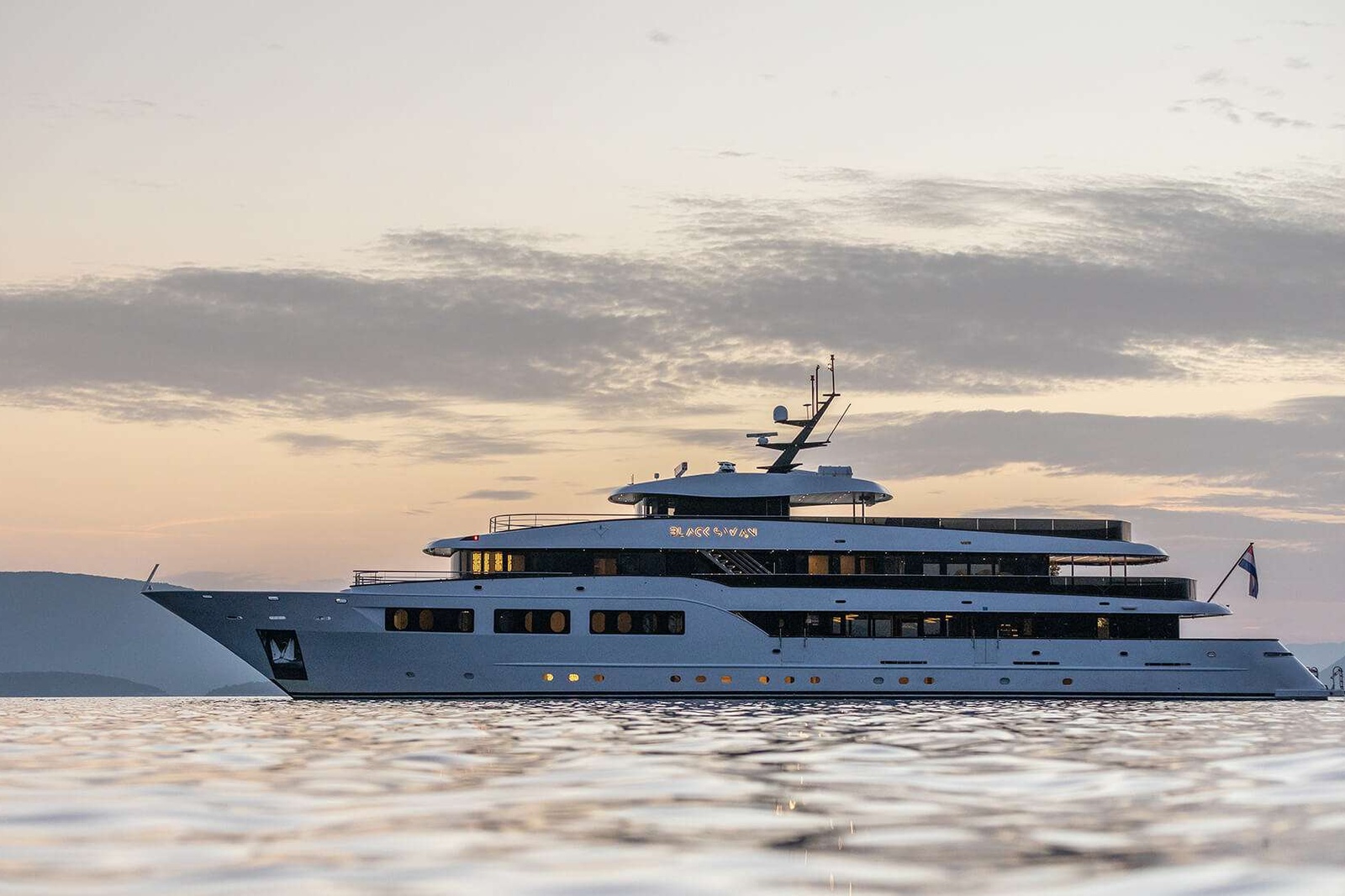 The Black Swan is coming our way  - We are very pleased to announce some very big news: the gorgeous, one-of-a-kind luxurious 49-meter motor vessel the Black Swan will nest in charter fleet in 2024. 

Custom-built in 2018 in Croatia as a premium boutique cruiser, the Black Swan stood out from the very beginning with its extravagant design and service tailored to the most discerning guests. She is now undergoing a complete refit to become a truly unique private luxury charter yacht with an extended crew and masterfully personalized service. 

Her name, the Black Swan, stands for beauty, grace and rarity. For the longest time, black swans were believed to be mythical creatures. Today, when we know for a fact they exist, they still lend their name to describe unexpected events that come as a surprise and create a far-reaching ripple effect. There is no doubt that the Black Swan will live up to her name.  
Once the refit is complete, she will offer plush accommodation for up to twenty guests in her ten double cabins. No less than three are master cabins, each situated on one deck. The remaining queen and king-size en suites  will be convertible into twins, allowing great flexibility for diverse or multigenerational parties. One multipurpose room on the lower deck can double as a single cabin or be transformed into a playroom, a PlayStation lounge for kids, a media cabin or an office.

Her ample common spaces are ideal for great time together as well as wonderful moments in privacy. Relaxation seekers will appreciate the many areas for soaking up the sun, from the expansive sundeck with sun loungers to the fly deck Jacuzzi where bubbly sunsets pair perfectly with a glass of champagne. Adventures are always on option, with water toys galore including  jet skis, water skis, sea bobs, SUPs, a water slide and more. Those who favor solid ground will love the e-bikes that make it easy to spontaneously explore islands and shores. 

With seamless communication between the indoor lounge and aft deck, her expansive main deck can host a variety of themes and feels. Opportunities for cozy and quiet moments sit scattered throughout. Guests can enjoy morning papers over an espresso by the library nook, sip on whiskey in the cigar corner and relish romantic whispers by the upright piano. Outside, sunset cocktails and dining al fresco come immersed in the gorgeous Adriatic sceneries. 

Dining is a special treat each time around, with a chef and sous chef fully dedicated to preparing delectable Mediterranean creations from the freshest ingredients sourced locally. Guests can enjoy Chef’s table dinners on the upper deck, breezy lunches in the aft deck lounge, and light snacks paired with the best wines anywhere, always tailored to special dietary requests. Whether a dinner is followed by starlit dancing by the sundeck cocktail bar, a casino night in the saloon or a movie night in the private indoor cinema, no two nights are alike. 
The gym and Finnish sauna make it easy to keep up health and fitness routines. With a masseur on board full time, every day can start with an energizing massage. Adding a yoga instructor to the crew is great for those who wish to start or end their days with a sunlit practice on the sundeck.  

Onboard the Black Swan, a dedicated crew of thirteen is made up of professionals with extensive experience of catering to the most refined preferences. A fully dedicated mainland-based concierge will take care of the guests’ special wishes, from organizing a batch of that special champagne for a party to tailoring excursions in the region. 
Coupling expansive space for twenty guests with deluxe comfort and state-of-the-art service, the tailored yachting experience onboard the Black Swan sets out to become as mythical as black swans themselves. 
What a great surprise to look forward to in 2024. 


