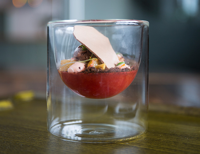 Pre dessert: blood orange jelly, orange rind, chocolate sorbet, chocolate soil, dehydrated tuile, fennel on Zieher double-walled glass half moon bowl