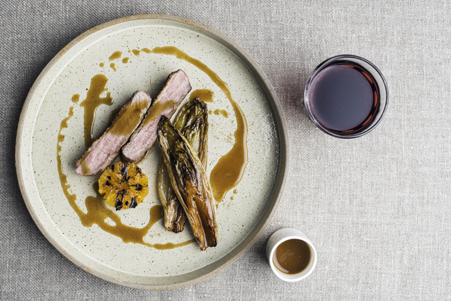 Roast breast of duck with caramelised chicory and charred clementines