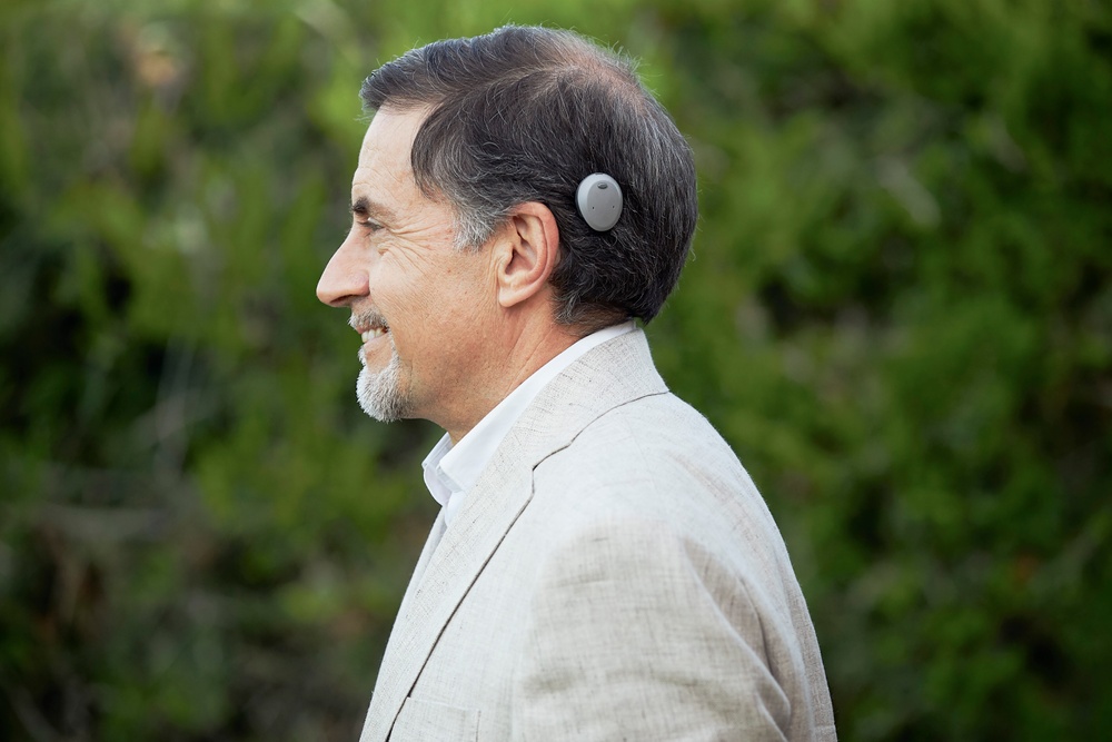 Man with Cochlear Osia