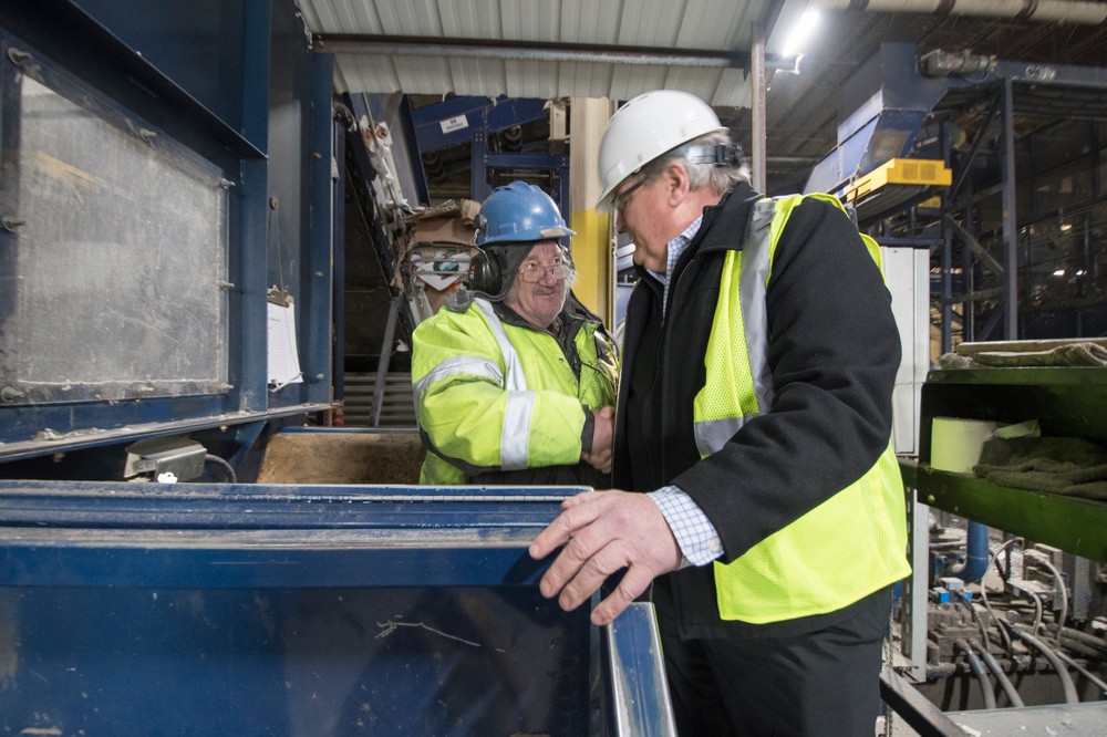 John Casella with frontline worker in Recycling Facility