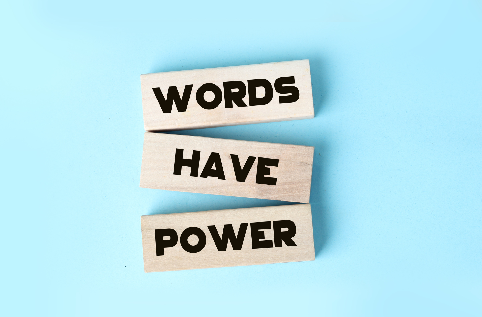 Words have power written on wooden blocks. Copywriters can help make your words even more powerful.