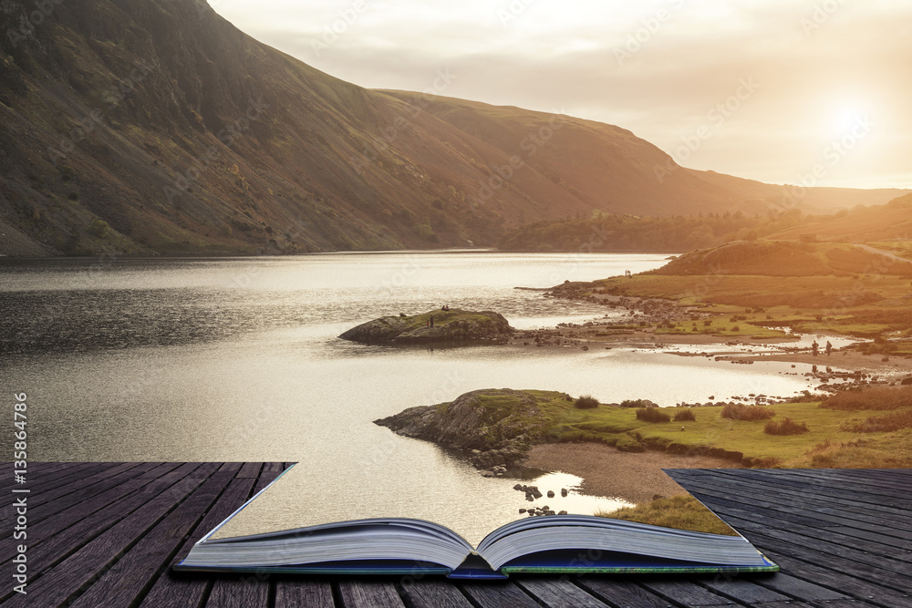 open book with lake and sunset in background