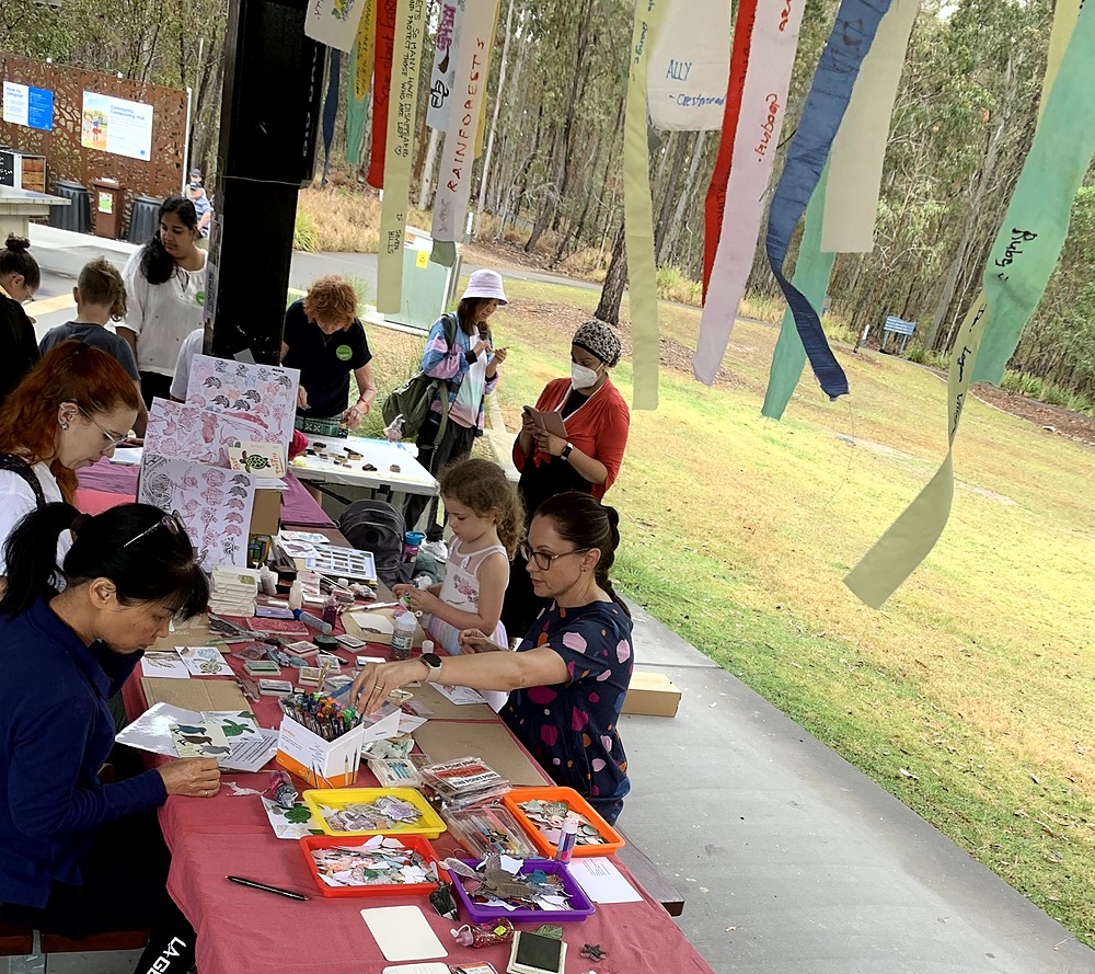 People making postcards & ribbons using stamps & colouring