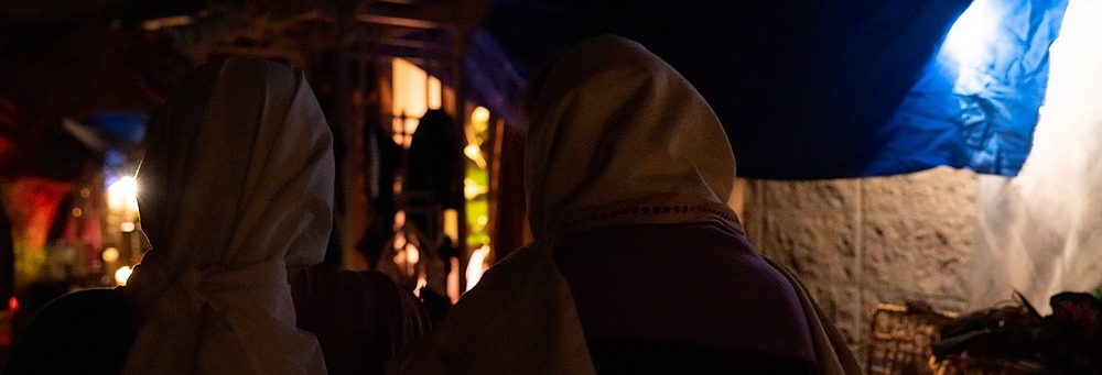 Two women walking through downtown Bethlehem