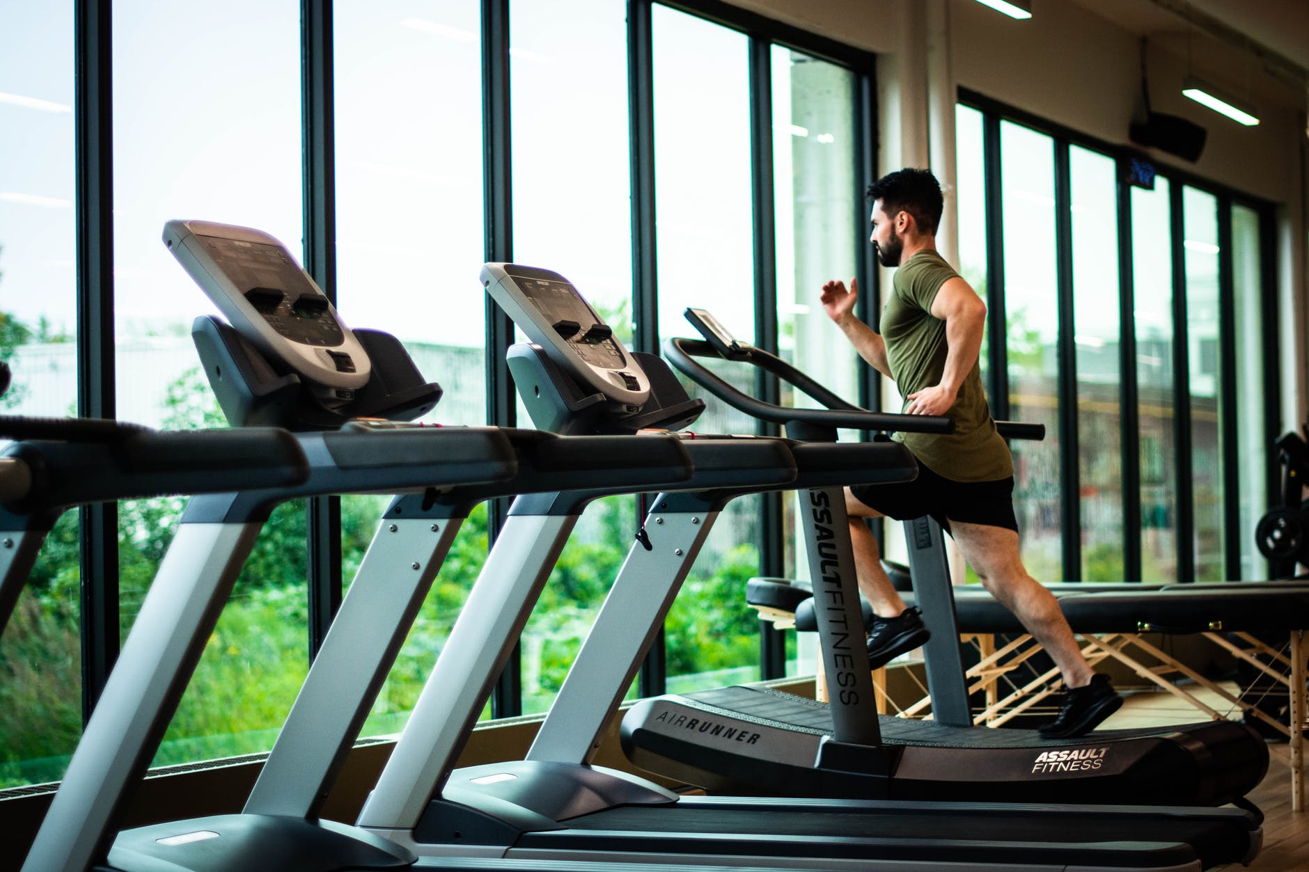 man using the treadmill in a fitness gym