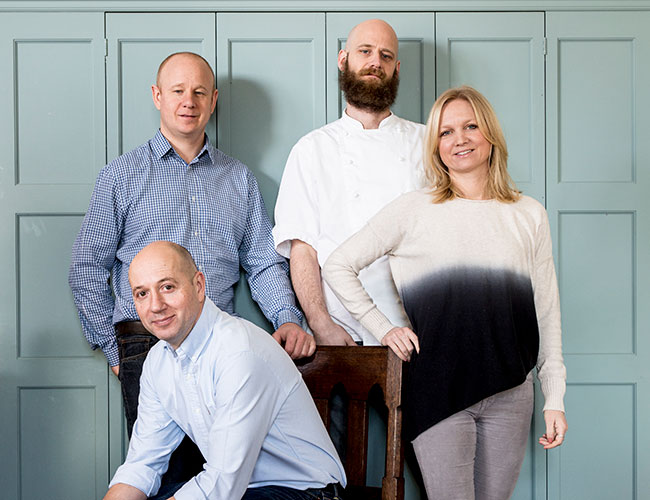 Pete Cornwell (seated) with, from left, Dave West, Scott Goss and Viv Cornwell