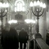 A panaroma photo from the bima of the synagogue looks back towards the front entrance.