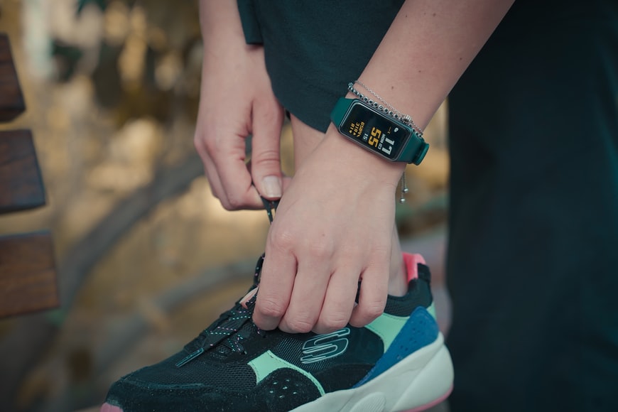 a person wearing a fitness tracker getting ready for a run
