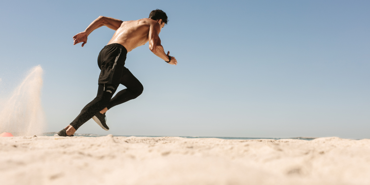 Sand sprints for burning calories while working out on the beach