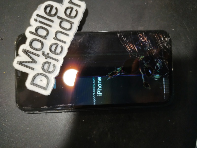 Damaged iPhone 11 with cracked screen showing partial display. Ghost touches caused lockout. Screen replaced, phone needs reset, data backed up to iCloud.