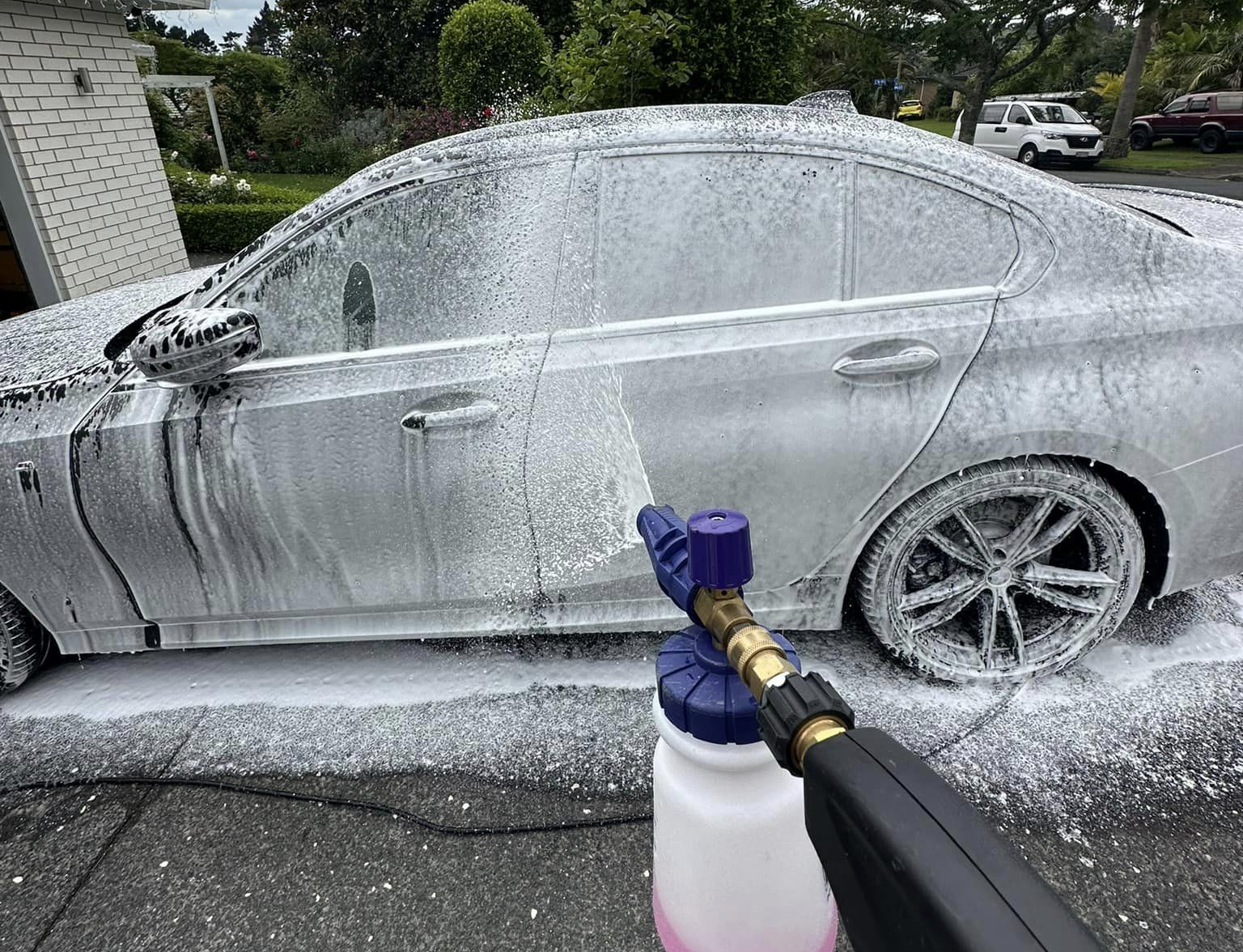 Foam Cannon Spraying Carwash onto all surfaces of a Sedan, in preparation for a Ceramic application