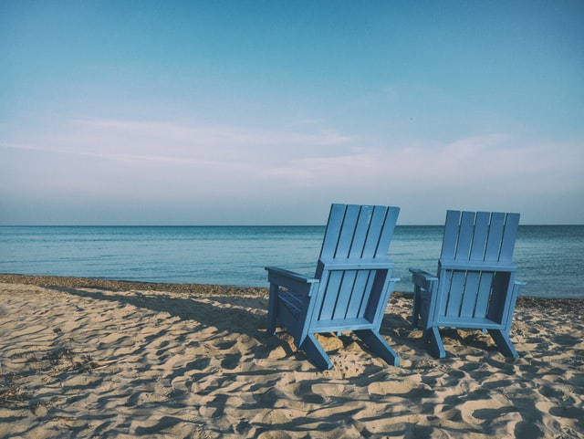 Empty seats on the beach representing a retirement plan.