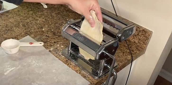 Dough being spread out