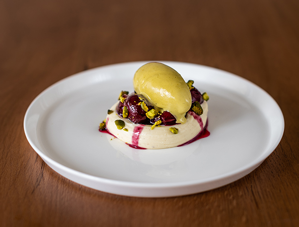 Poached cherries, white chocolate tofu, pistachio ice-cream