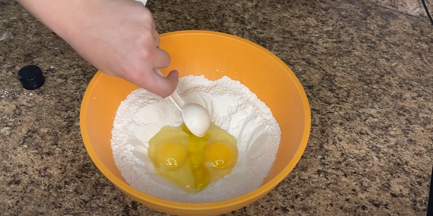 Tortellini dough ingredients in a bowl