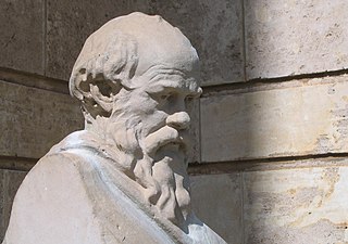 Stone statue of Socrates in deep thought.