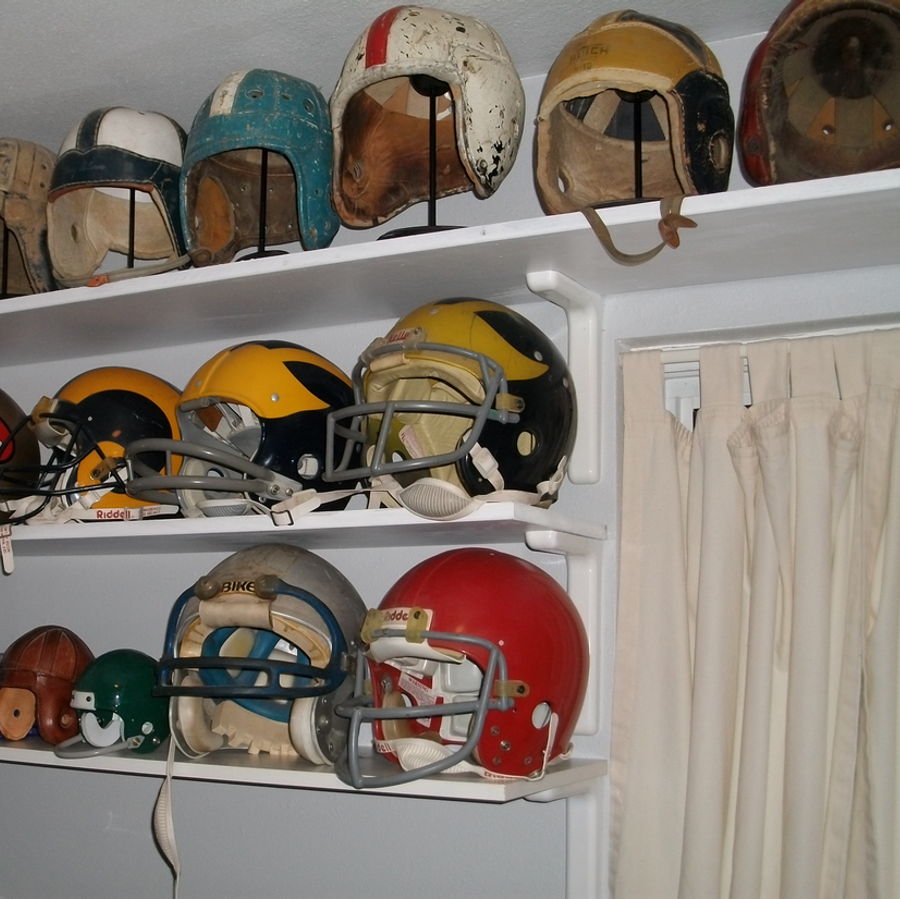 Various football helmets from the 1930s to the mid 1980s