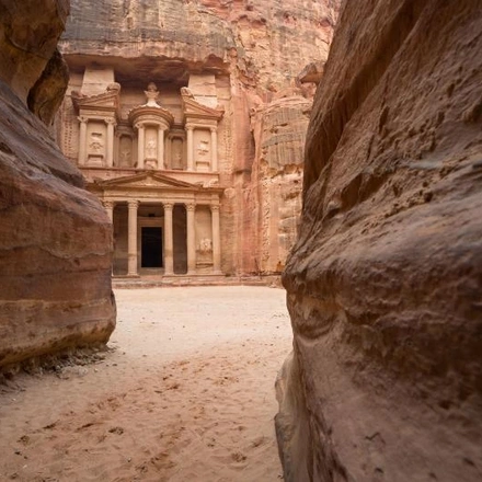 The Treasury appearing at the end of the Siq Canyon - Petra