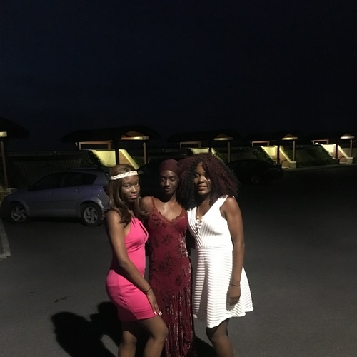 My roommate in the pink dress and our new friend Fatou in the middle and Me in the white