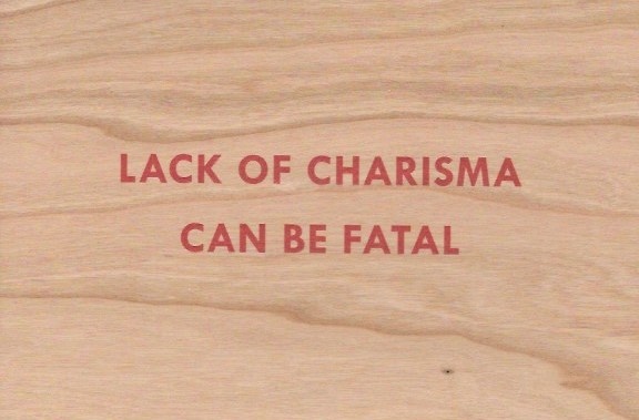 Lack of Charisma Can Be Fatal Wooden Postcard [Red Text]