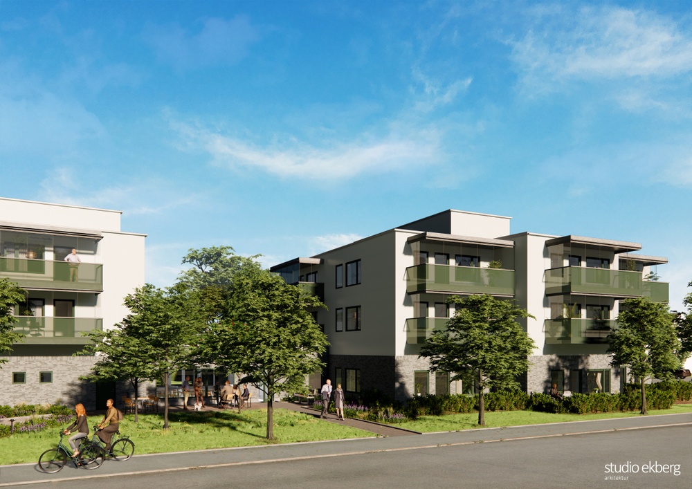 Animerad bild från arkitektbyrå över hur hyreshusen med trygghetslägenheter kommer att se ut på fastigheten Lärkfalken 9 i Grästorp. Ljusa hus med gröna balkonger. 