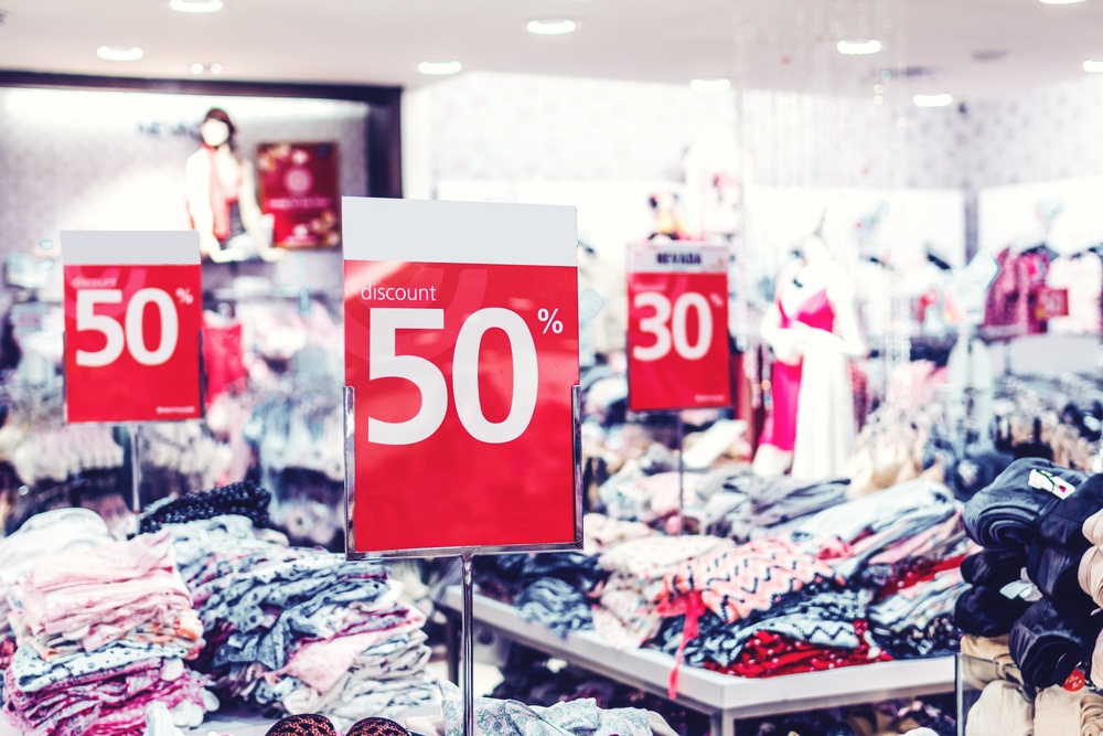 Discount signs in clothing store