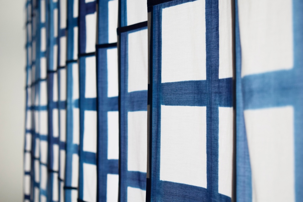 
Stockholm Design Week: Ung Svensk Form/Young Swedish Design 2020. 4 February - 22 March. KAJSA SAMUELSSON – BEGINNING MIDDLE AND
My work comprises a textile installation in a vat-dyed silk and cotton blend. The work is part of a larger project where I looked at the relationship between textile and pattern, and how a textile philosophy can influence my artistic practice.

Jury citation
Ambitious, well-considered and seemingly simple, with impressive precision in the scale. We recognise the pattern from the traditional tea towel, an everyday phenomenon that has been magnified for the public space into a monumental manifestation.
