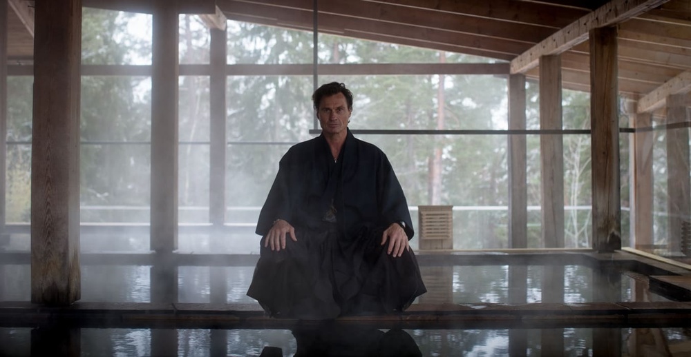 Petter Stordalen wearing traditional Japanese attire - the Yukata. Sitting in by the terrace hot springs at Yasuragi