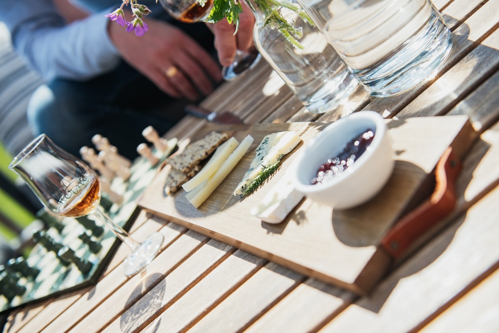 Hernö Gin Bistro, exterior, cheese on wooden plate, chess, sipping gin