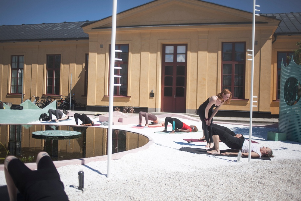 Yoga at 'Studio Ossidiana: Utomhusverket 2021'. Photograph: Sima Korenivski. Courtesy of ArkDes.