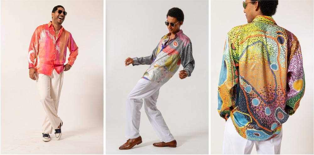 Three happy men wearing colorful silk shirts with abstract prints by fashion designer Ricardo Bernardino inspired by paintings by Michel Deville.