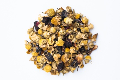 A small pile of dried chamomile flowers that come in a Free Your Tea subscription box.